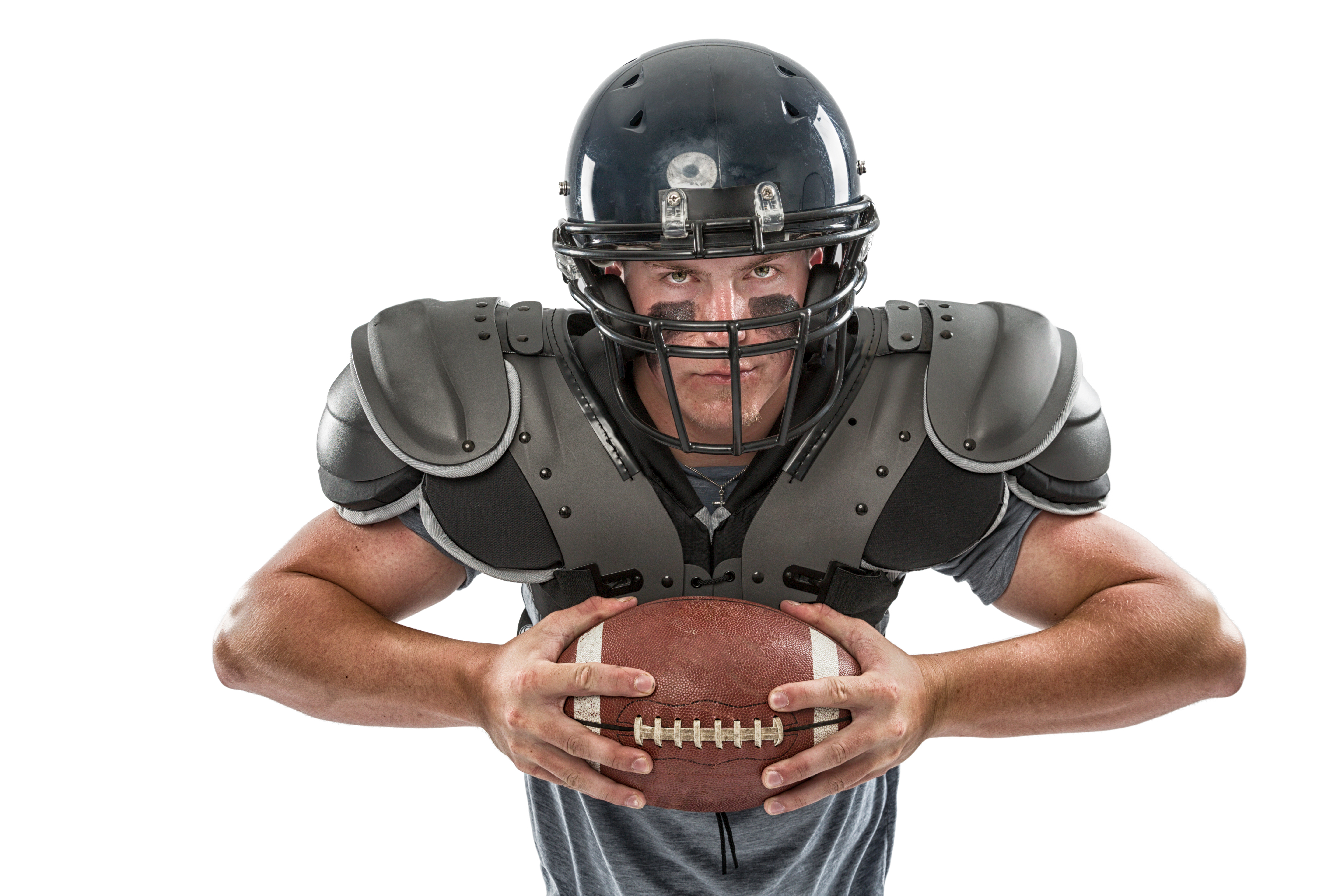 Football player in pads, helmet, football_iStock-155381947